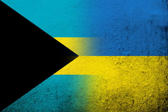 The Commonwealth of The Bahamas national flag with National flag of Ukraine. Grunge background © Chernobrovin