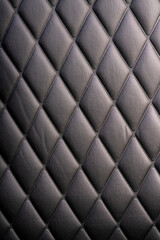 Black leather check pattern interior details of modern luxury sport cars. Comfortable leather...