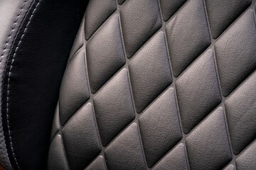 Black leather check pattern interior details of modern luxury sport cars. Comfortable leather...