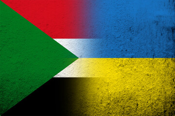 the Republic of the Sudan National flag with National flag of Ukraine. Grunge background