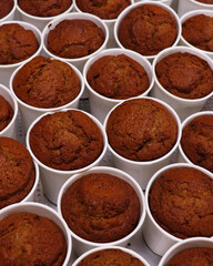 a batch of baked date pudding in white cups