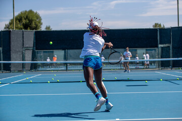 Young athlete at tennis summer camp - obrazy, fototapety, plakaty