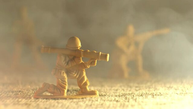 Smoke envelops a plastic toy soldier grenade launcher