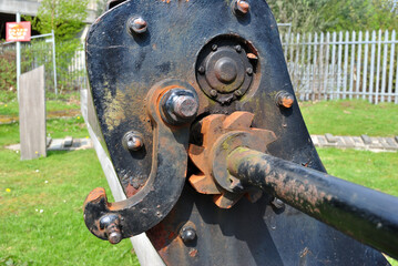 Outdoor Rusty Steel Mechanism with Toothed Gear in Close Up 