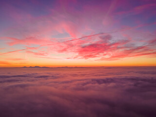 Fototapeta na wymiar Sunset Above Clouds & Mountains from Drone