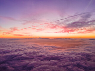 Sunset Above Clouds & Mountains from Drone