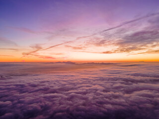 Sunset Above Clouds & Mountains from Drone