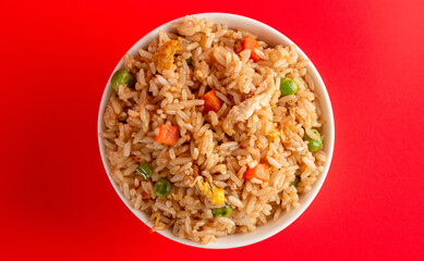 Bowl of Fried Rice on a Red Background