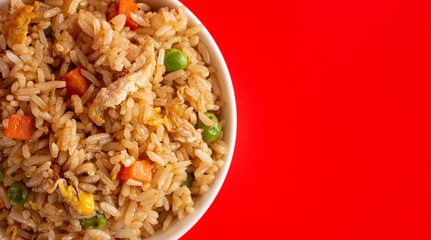 Bowl of Fried Rice on a Red Background