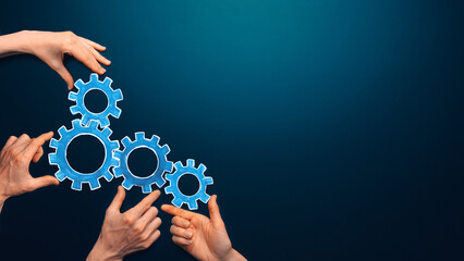 Teamwork concept. team connects gear parts. Idea of partnership, cooperation, team work. Metaphor for joining a partnership as diverse gears connected together as a corporate symbol. Copy space
