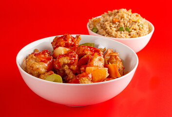Bowl of Fried Chicken and Vegetables with Sweet and Sour Sauce and Fried Rice