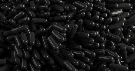 close up of a pile of black pills