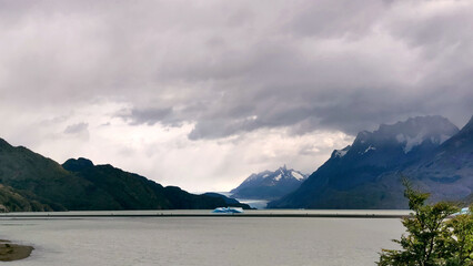 Fototapeta na wymiar Panoramic view of Lake Grey at Torres Del Paine National Park on a cloudy day, Chile.