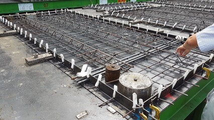 Precast concrete girder slab on a pallet with reinforcement and installation parts i ready for...