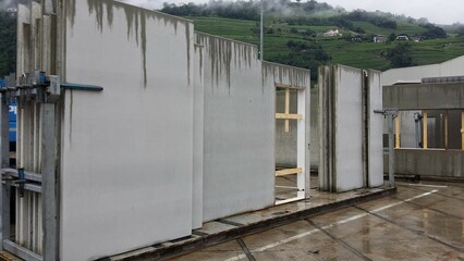 Precast concrete solid walls in a transport rack ready for transport to the construction site