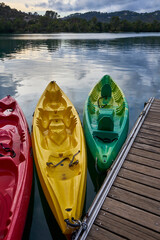 Three Kayaks at Sunset moored to a pontoon on the edge of Lac d'Esparron Provence France