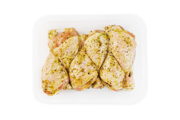 Marinated chicken leg in red sauce on isolated white background.Copy space.Semifinished. Fast cooking.Raw marinated chicken meat.Top view.