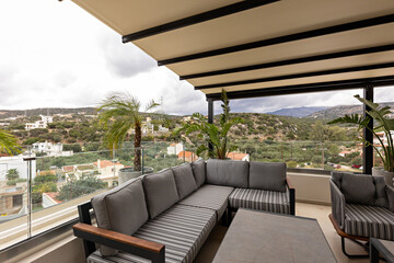 Hotel resort apartment terraces with armchairs and table