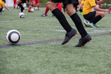 Young football player practicing