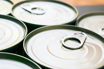 Canned food in Aluminum cans set closeup.