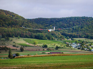 Naklejka premium A model plane lands on an alpine pasture in Switzerland