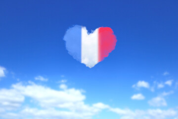 Naklejka na ściany i meble フランスの国旗色のハート形の雲が浮かぶ青空 