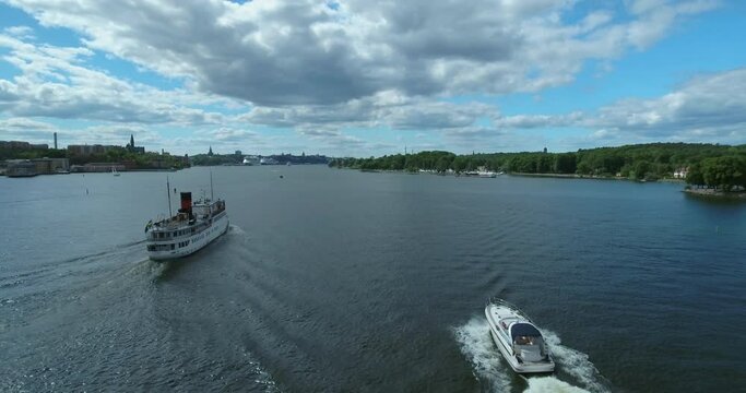 Aerial Forward Scenic Shot Of Motorboats Moving On Sea Water - Stockholm, Sweden