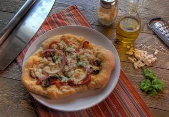 Top view of Neoplitan Style pizza on natural wood surface