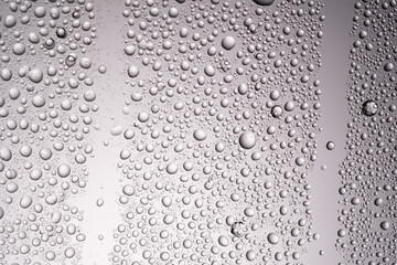 Drops of water on a transparent gray background.