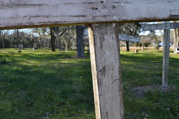 Fototapeta na wymiar White crosses on the old graves at Hodges Bend Cemetery, Sugar Land, Texas