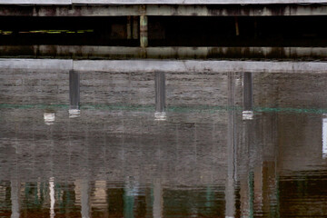 Fototapeta na wymiar Reflection of Boardwalk on Lake at Dus