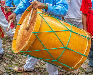 person in costume with drum during brazilian carnivalistic party 