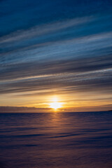 Obraz premium Sunrise over frozen Lake Huron