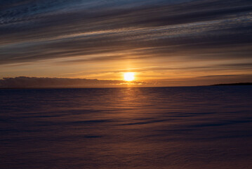 Fototapeta na wymiar Sunrise over frozen Lake Huron