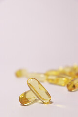 close up of fish oil capsules isolated on a white background