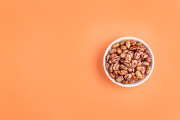 Dried pinto beans in the ceramic bowl - Phaseolus vulgaris