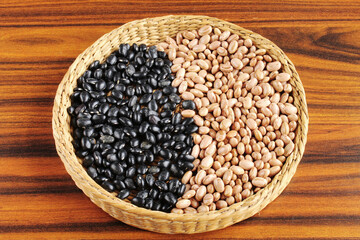 Carioca beans and black beans in a wicker basket.