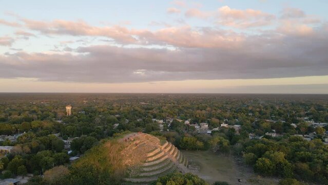 Wide angle drone shot of the famous mayan pyramid "Pir&aacute;mide Kinich Kakm&oacute;" shot during sunset located in the city of Izamal in the state of Yucatan in Mexico shot in 4k.