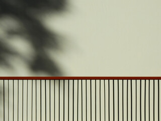 metal fence with shadow of leaf on white wall background