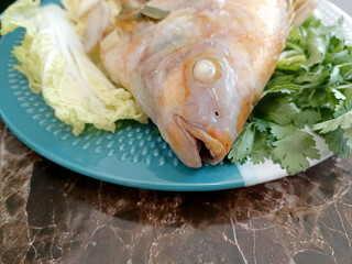 Steamed Fish with Chili Lime Sauce,thai Traditional Thai food. : thai style steamed fish on table close up 