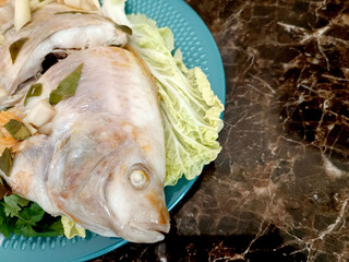 Steamed Fish with Chili Lime Sauce,thai Traditional Thai food. : thai style steamed fish on table close up 