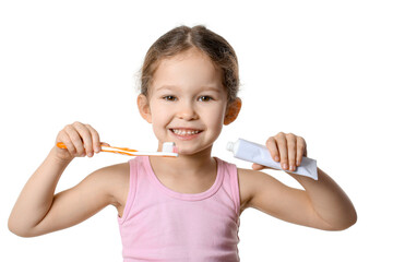 Adorable little girl with tooth brush and paste on white background
