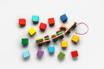 Fototapeta na wymiar Wooden cubes with blocks on light background