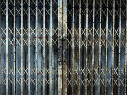 traditional blue metal roller door with stian of engine oil