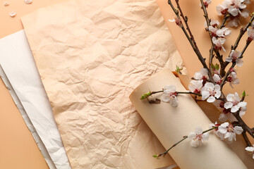 Naklejka na ściany i meble Beautiful blooming spring branches and vintage paper on beige background