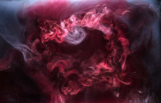Black and red ink background, colorful fog, abstract swirling ocean, acrylic paint pigment underwater, white smoke