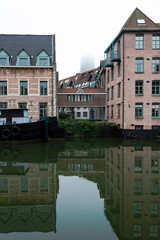 Naklejka premium Architectural detail of the Haverwerf (oat yard), a street located at the banks of the river Dyle and an ancient trade market for oats in the city center of Mechelen, Belgium