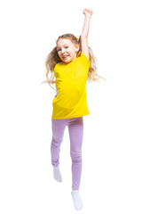A happy and cheerful child dressed in a yellow T-shirt and purple pants plays, jumps.