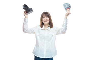 Portrait of a young woman in a white shirt holding a camera and US dollars in her hand. The concept of a successful photographer, wedding photographer, photo for documents, payment of taxes. Isolated