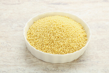 Raw couscous in the bowl